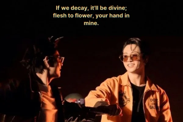 If we decay, it'll be divine; flesh to flower, your hand in mine.