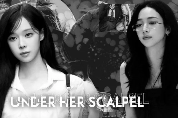 Under her scalpel.
